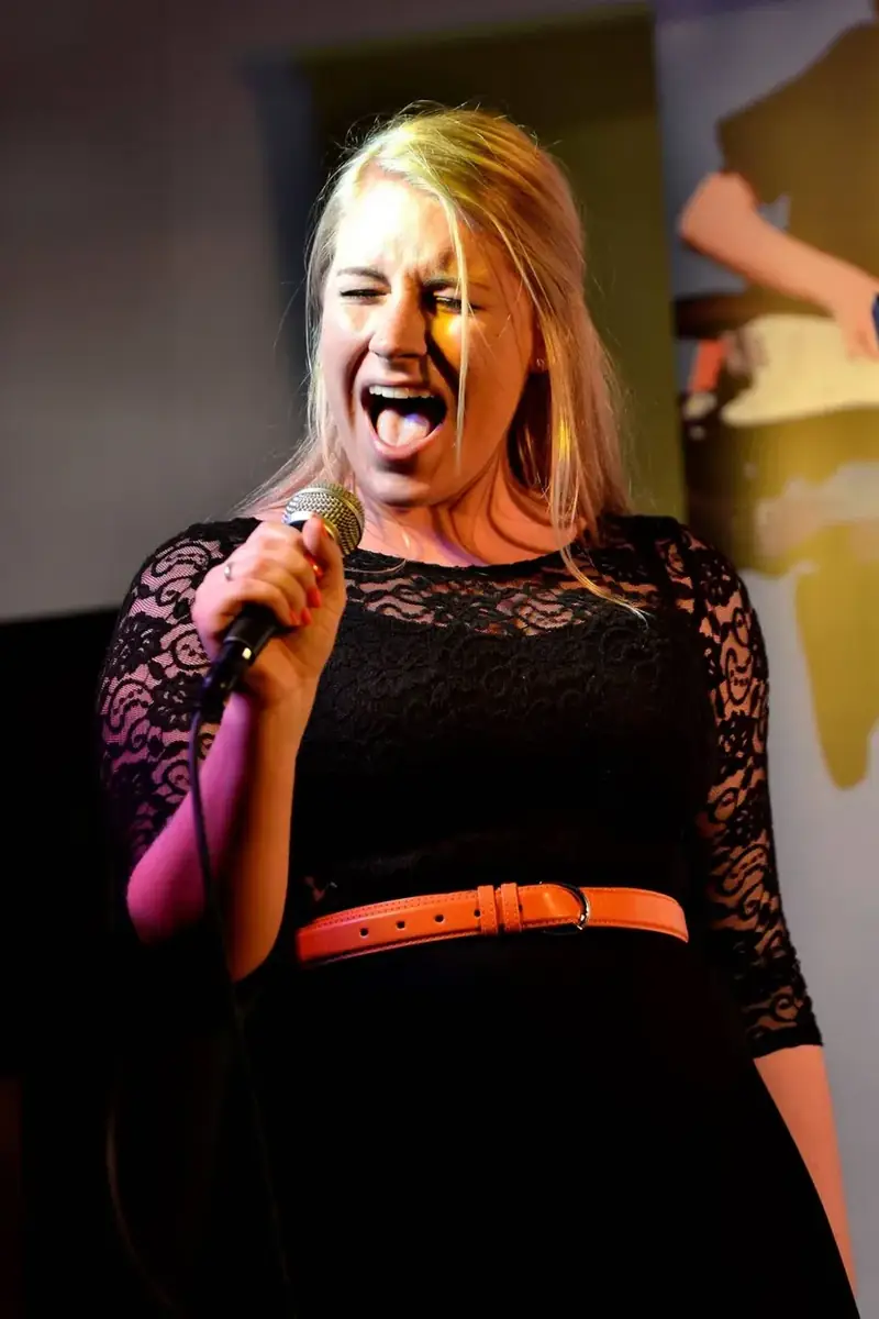 An adult singing student performing live at a Morningside School of Music showcase in Edinburgh An adult singing student performing live at a Morningside School of Music showcase in Edinburgh