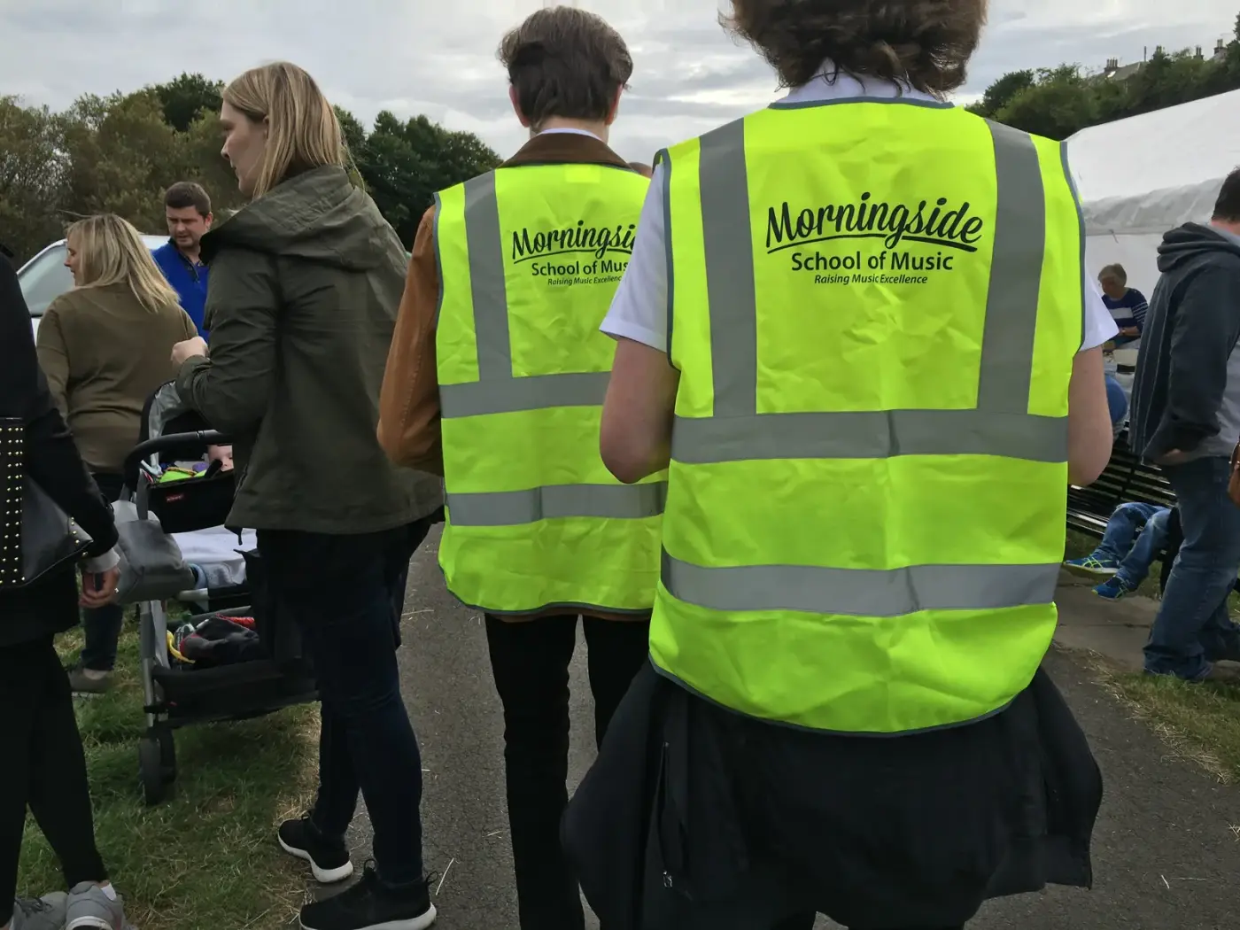 Safeguarding at Morningside School of Music Morningside School of Music volunteers in branded hi-vis vests supervising a community charity event