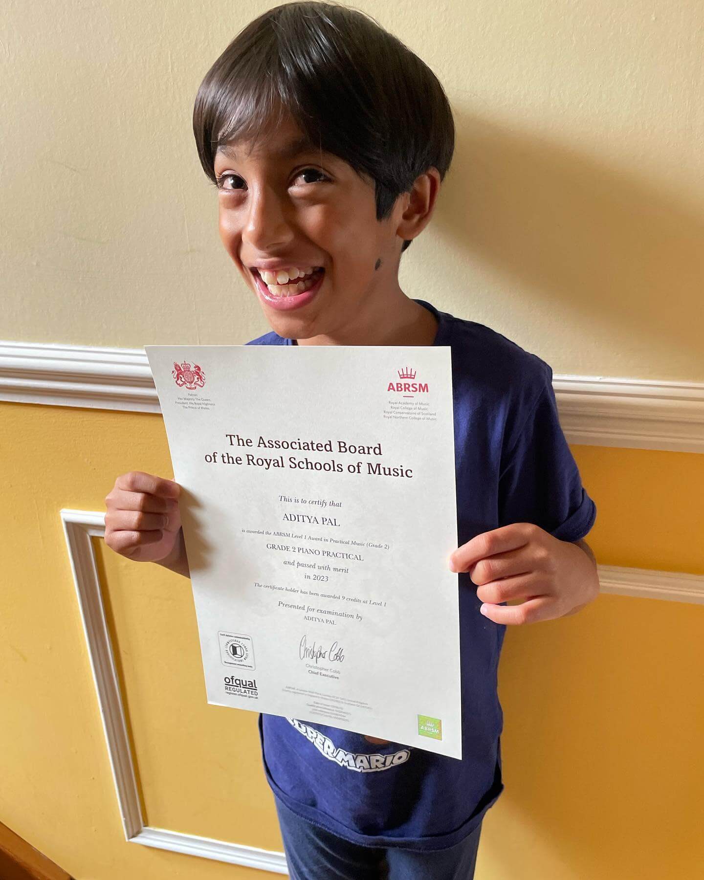 Edinburgh Guitar Lessons – Fun, Professional Tuition for All Ages | Morningside School of Music Young guitar student at Morningside School of Music with his certificate